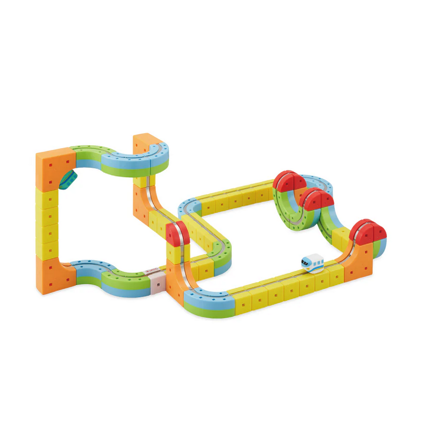 Colorful toy marble track set on a white background