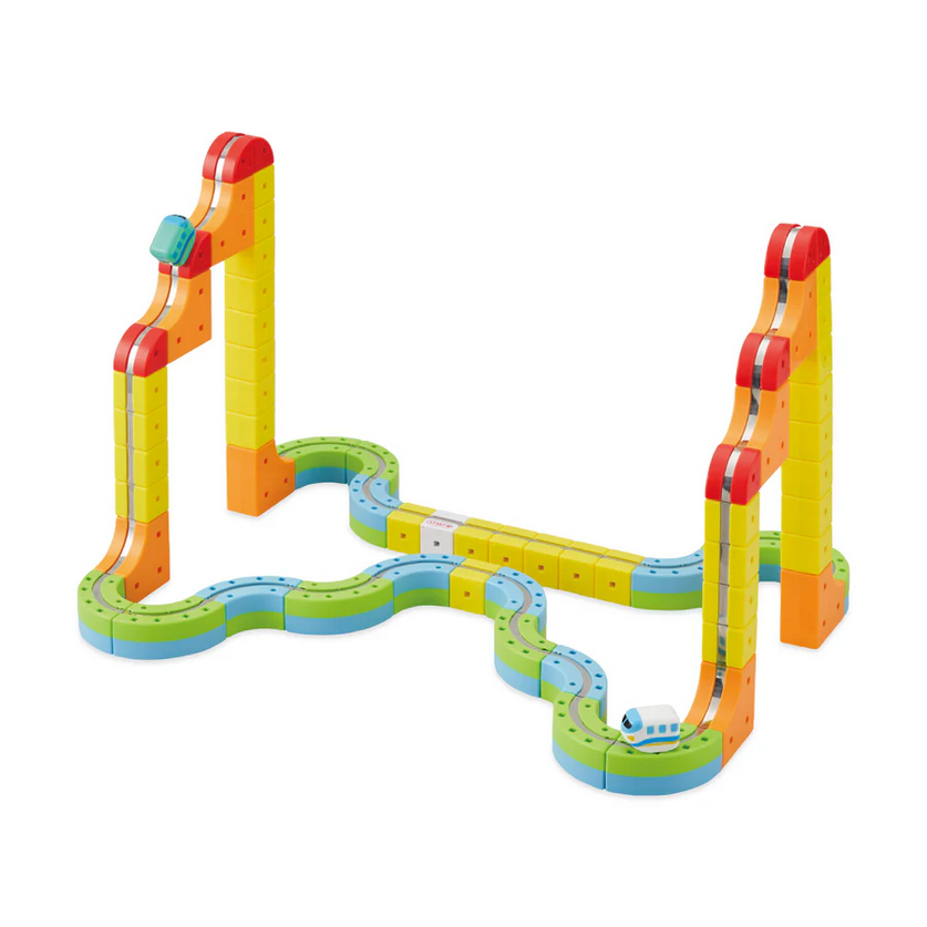 Colorful toy marble track set on a white background
