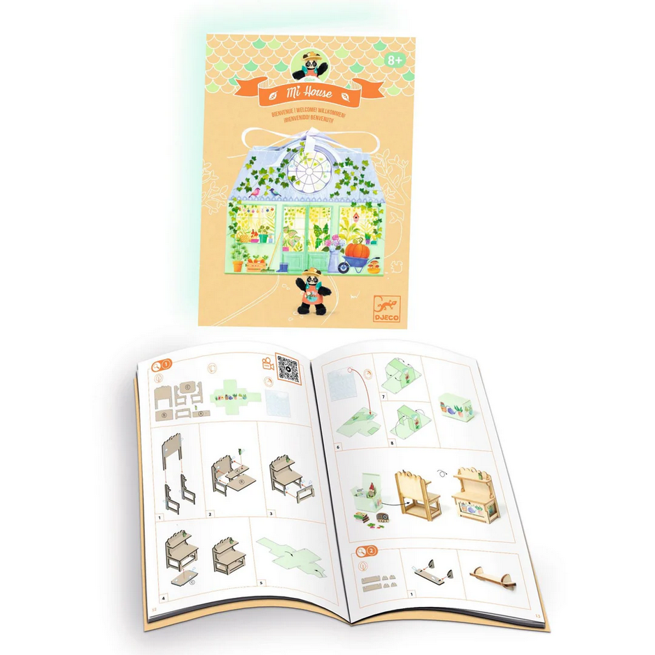 Children's activity book with illustrated house and furniture pieces on a white background