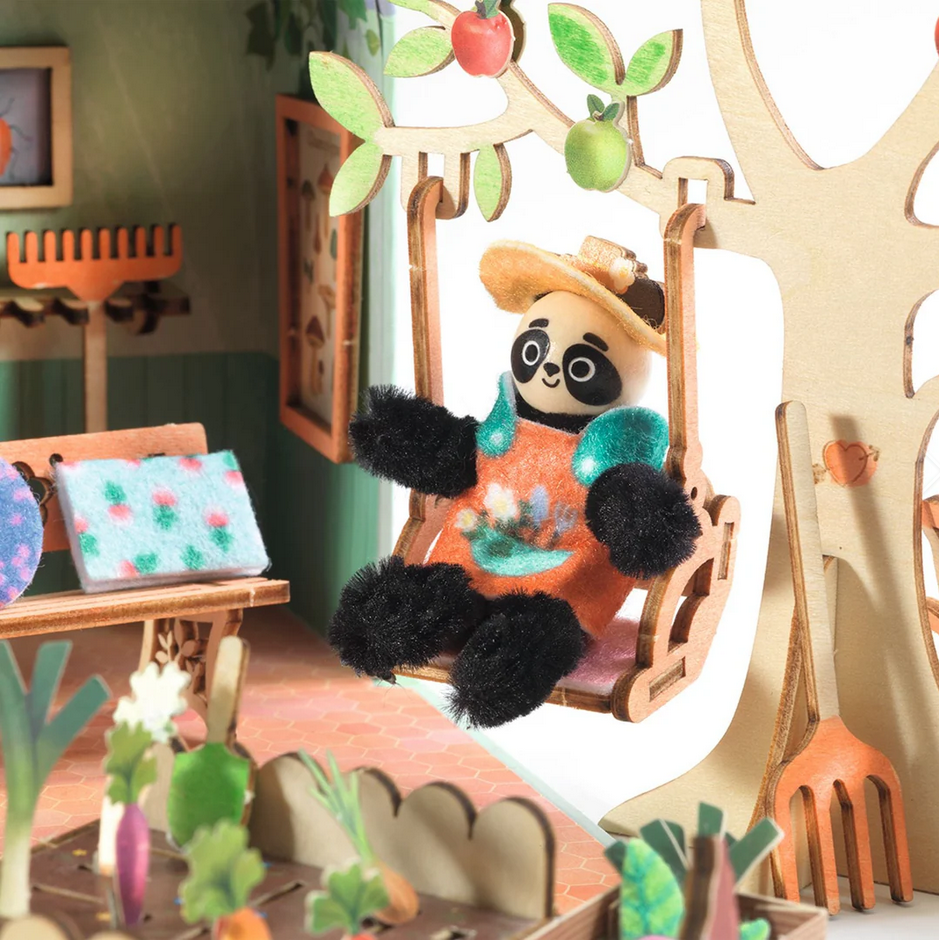 Panda toy in a wooden swing with a colorful background