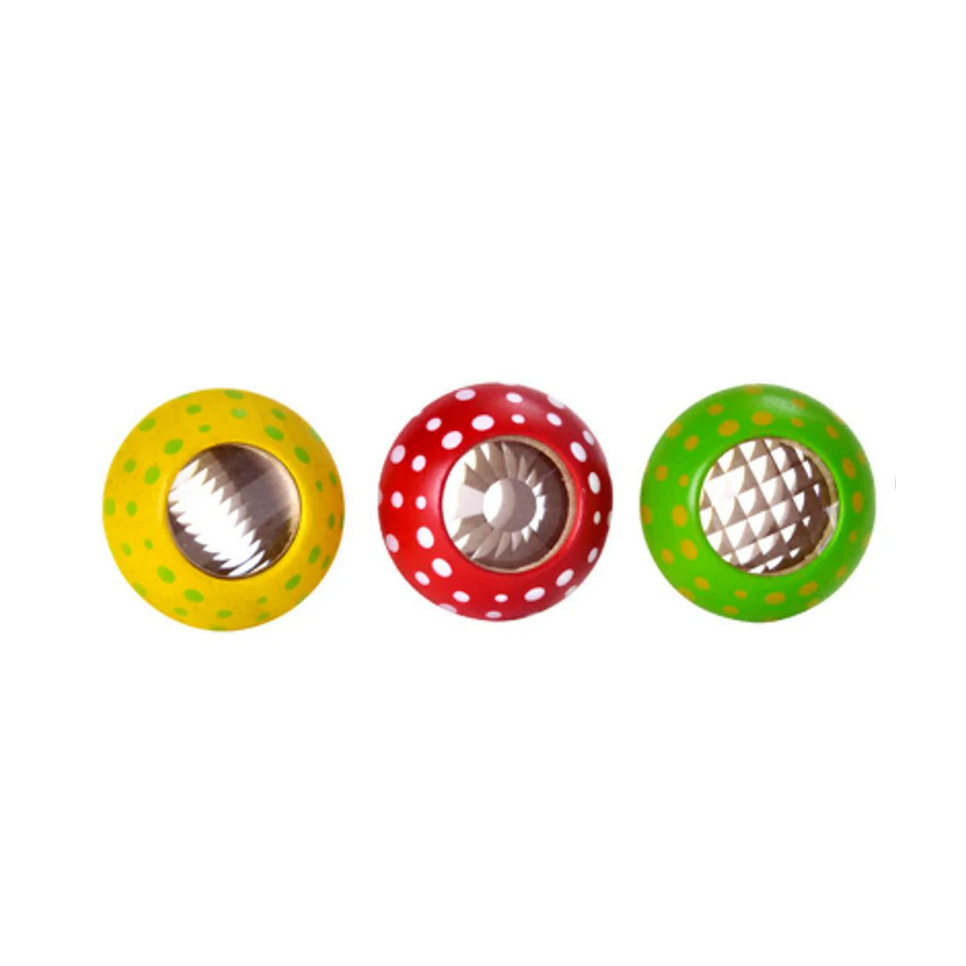 Three colorful pet toys with different textures on a white background