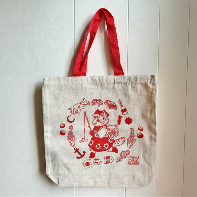 Tote bag with red design on a white background