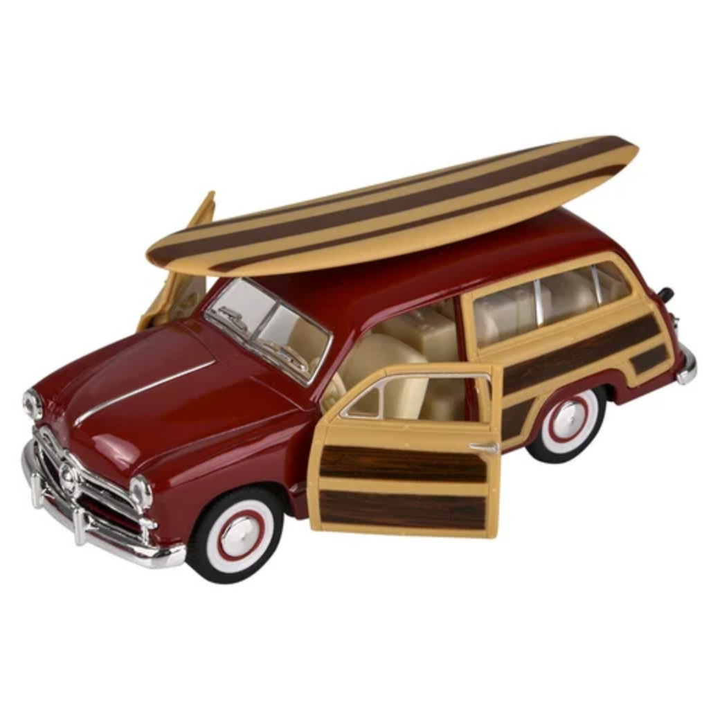 Model of a vintage station wagon with a surfboard on top, featuring wood paneling and red body.