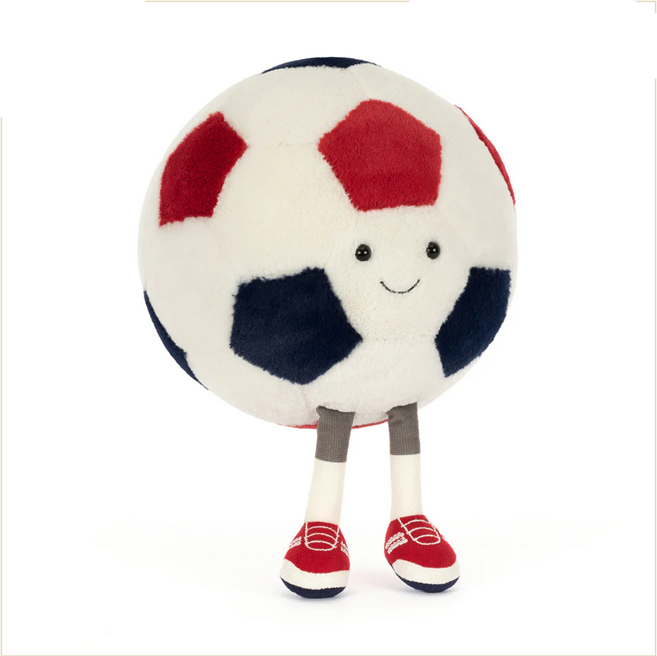 Plush toy soccer ball with a smiling face, red and blue accents, on a white background.