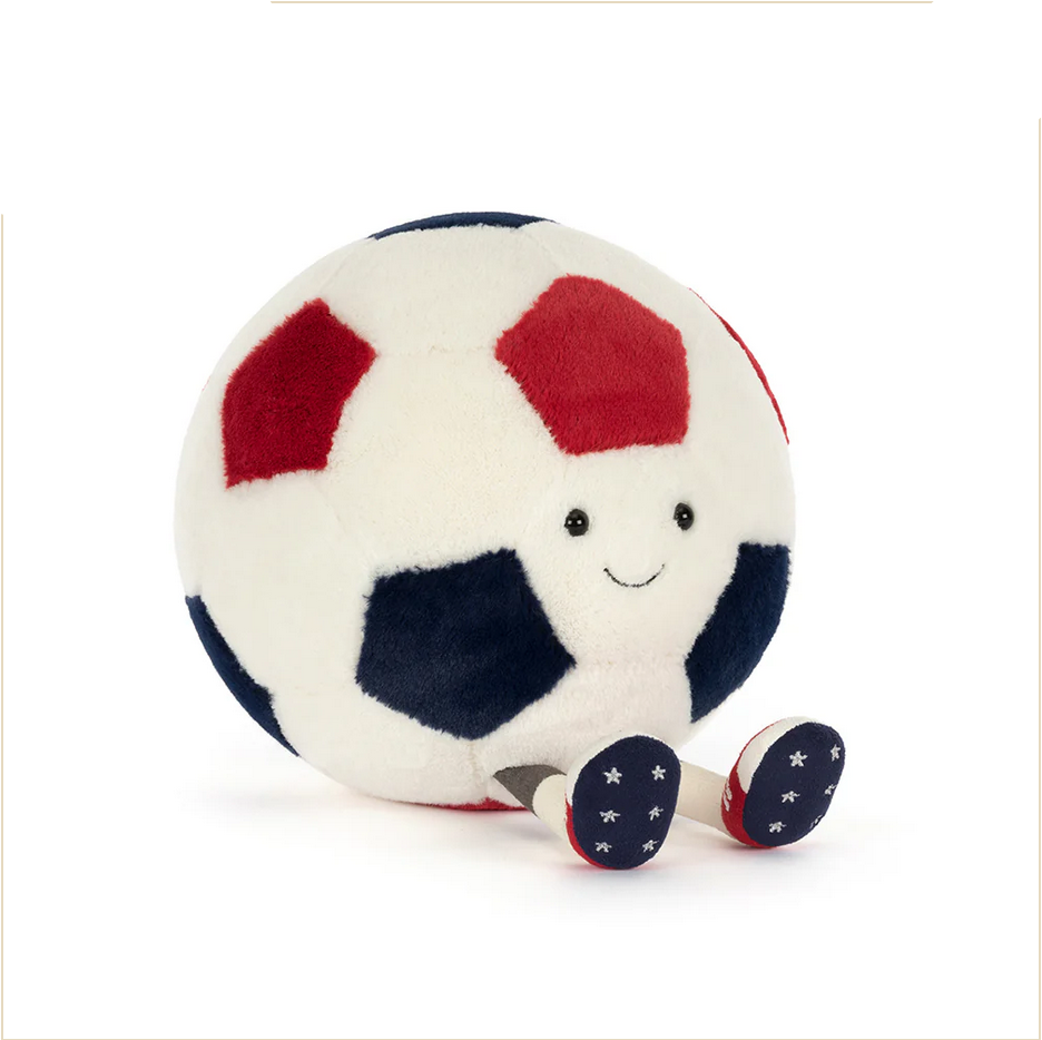 Plush toy soccer ball with a smiling face on a white background