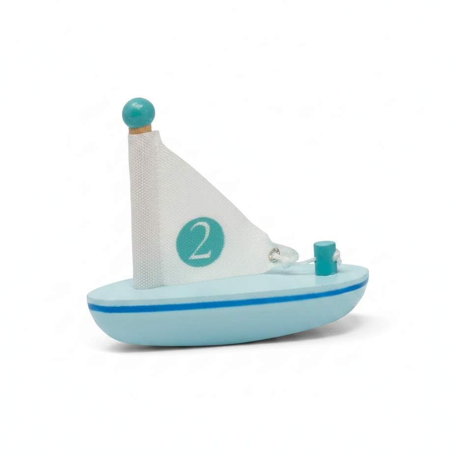 Two toy sailboats with numbered sails on a white background