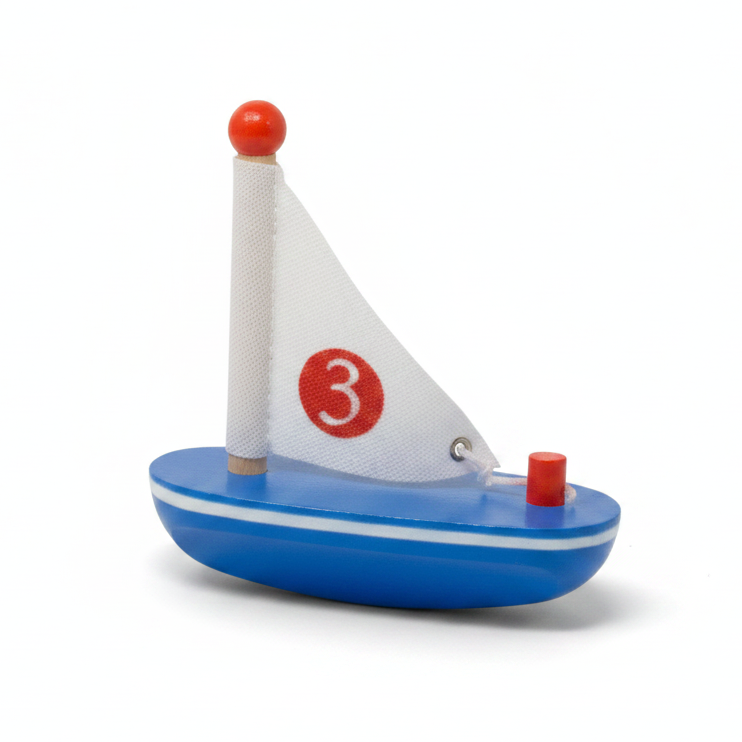 Small toy sailboat with a white sail displaying the number 3 on a white background
