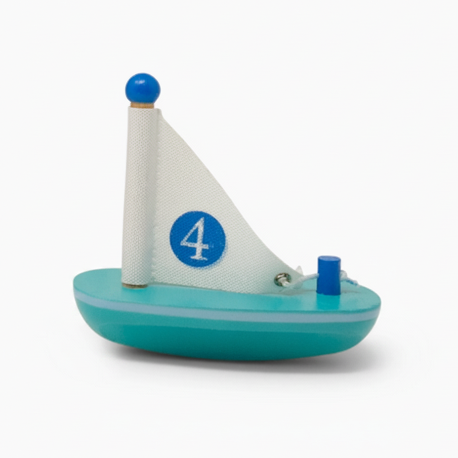 Toy sailboat with a white sail featuring the number 4 on a white background