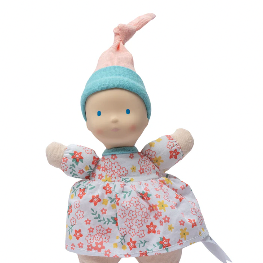 Toy doll with floral dress and blue hat