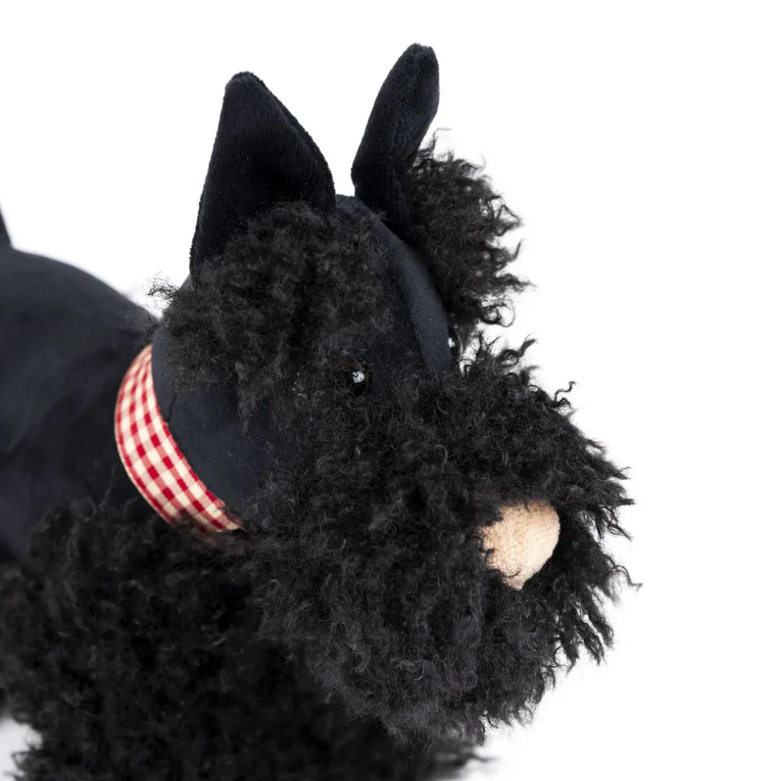 Black Scottie dog plush toy with a red and white checkered collar on a white background