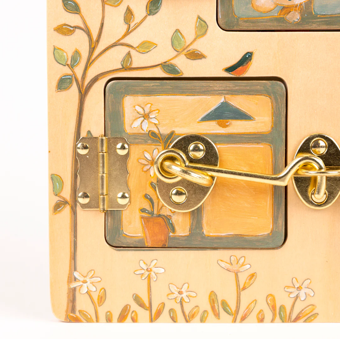 Decorative door handle with artistic design on a beige background