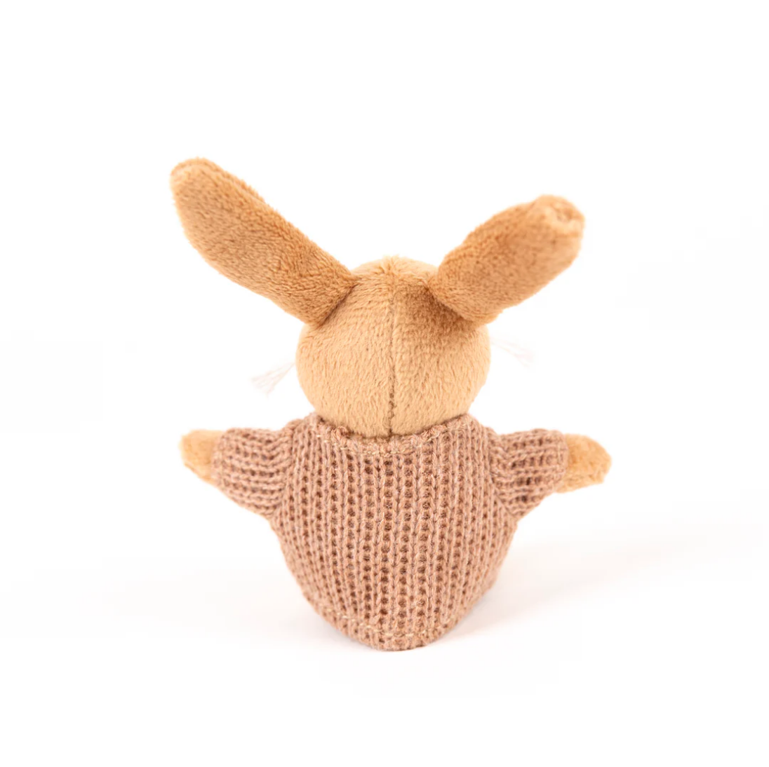Knitted toy resembling a rabbit on a white background