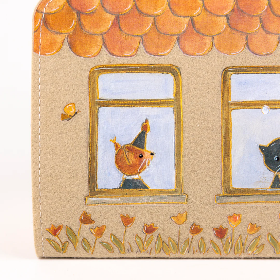 Illustrated bag cover with a cat and a butterfly looking out of windows, surrounded by flowers.