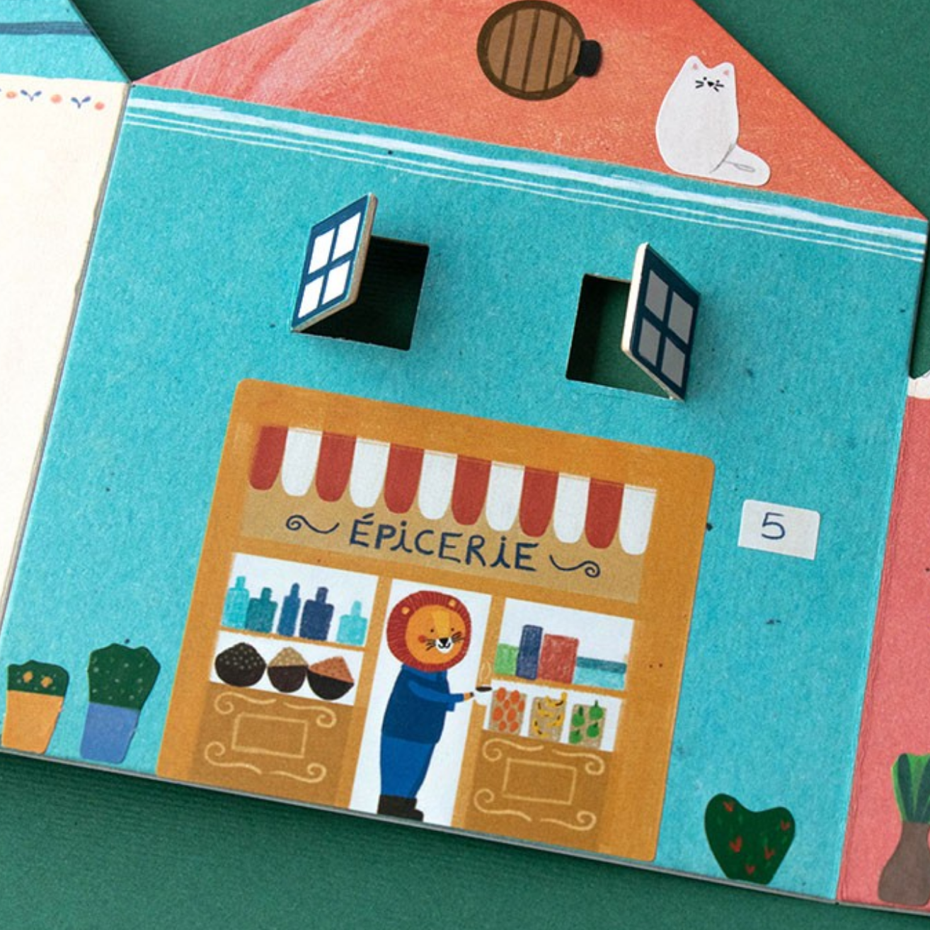 Children's book with a colorful illustration of a store front and a character inside on a green background.