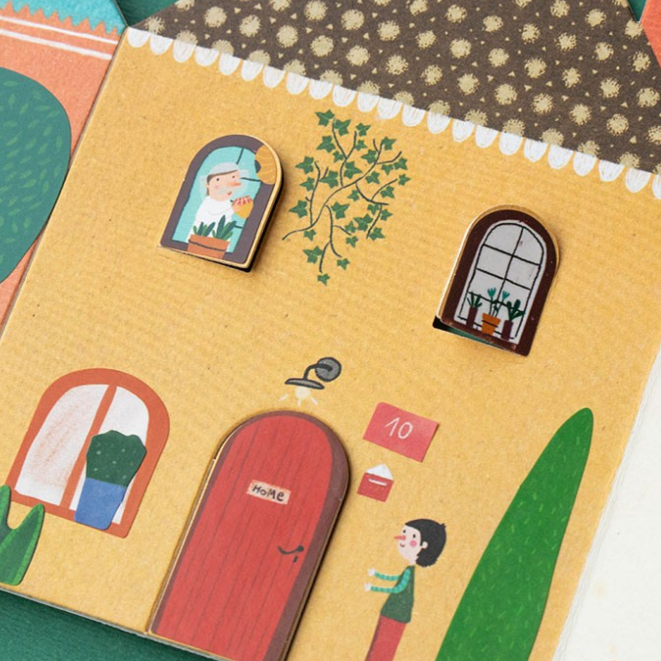 Children's book with illustrations of a house, door, and characters on a green background