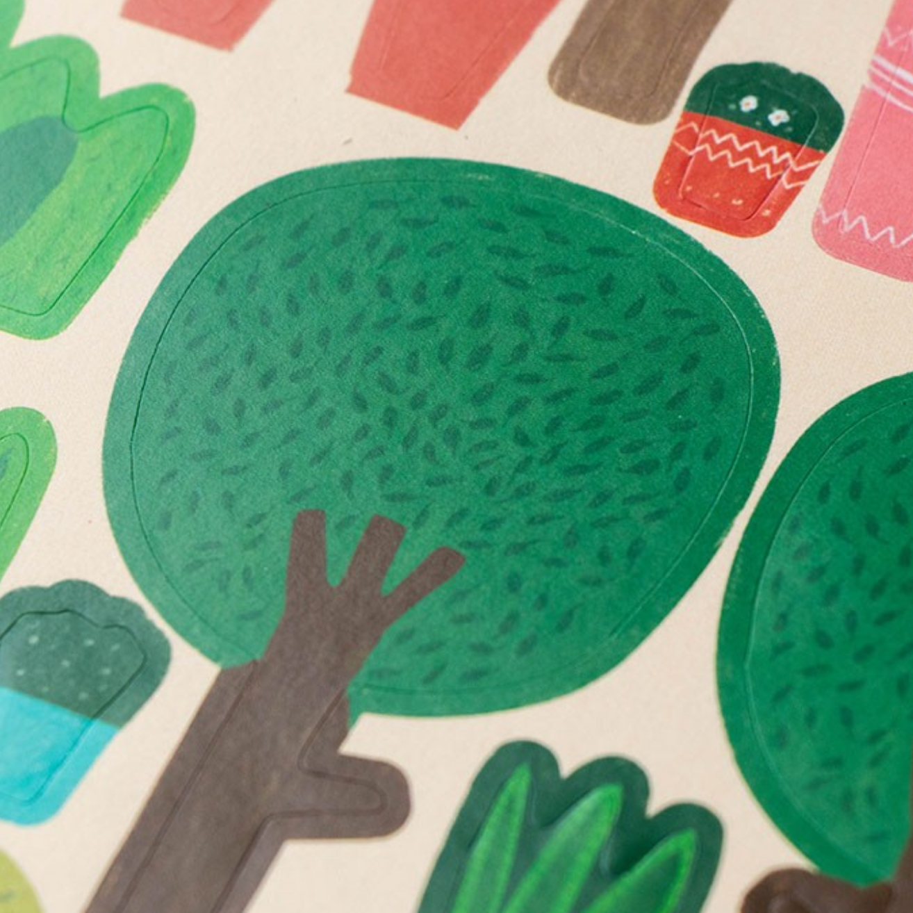 Colorful tree and cupcake illustrations on a patterned background