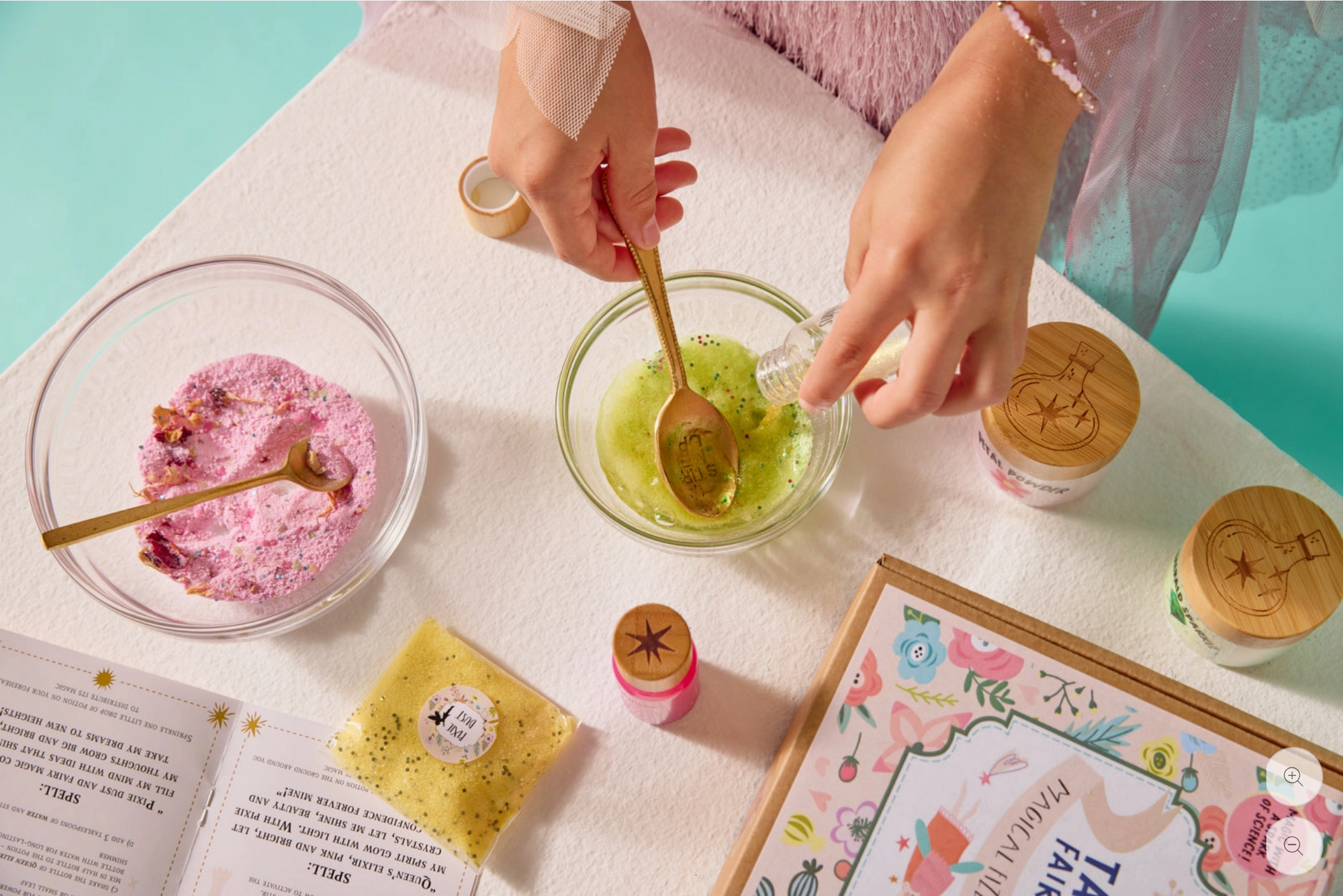 Person preparing a dessert with pink and green ingredients on a table.