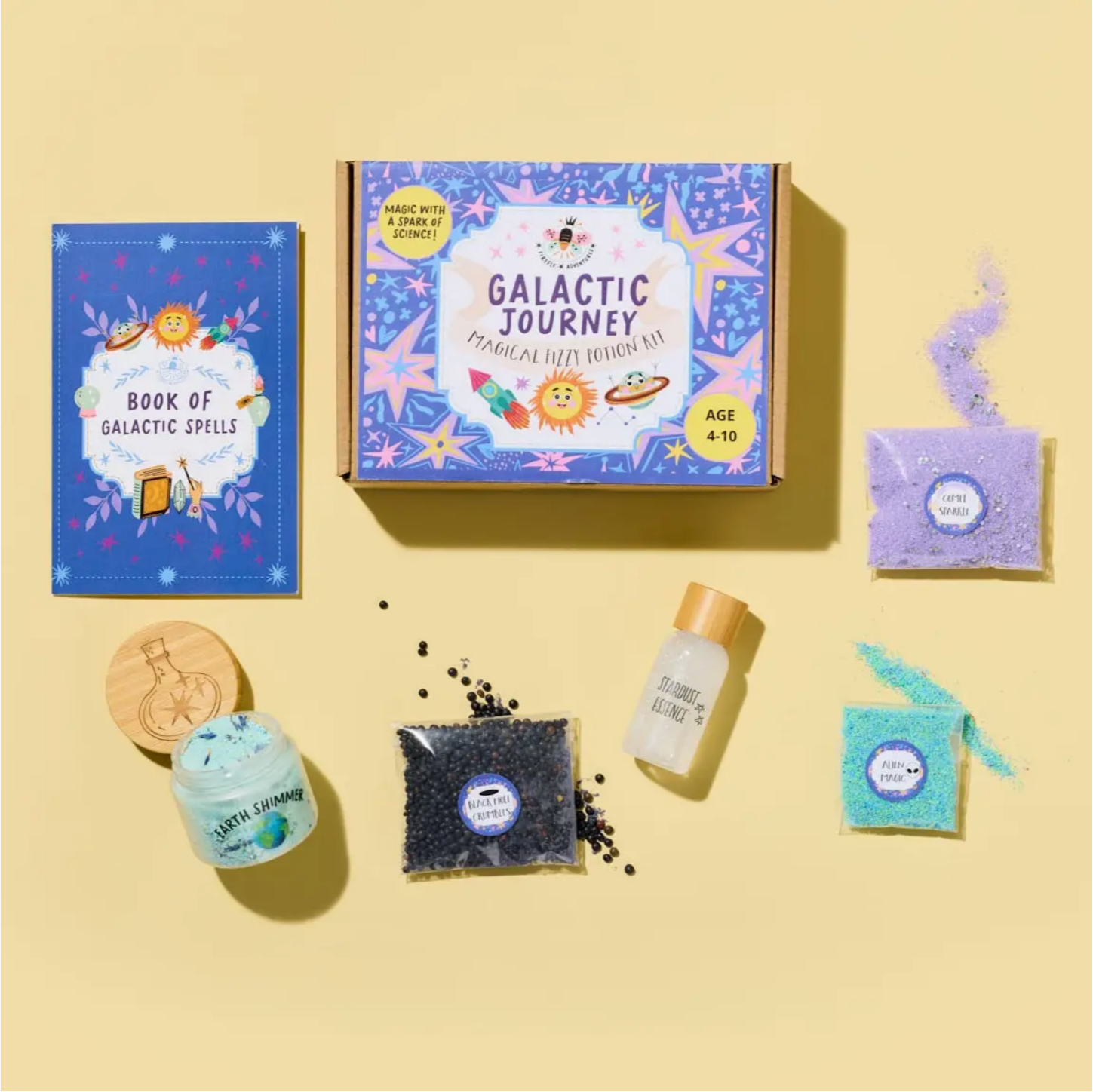 Galactic Journey playset with book, bath bomb, and other items on a yellow background