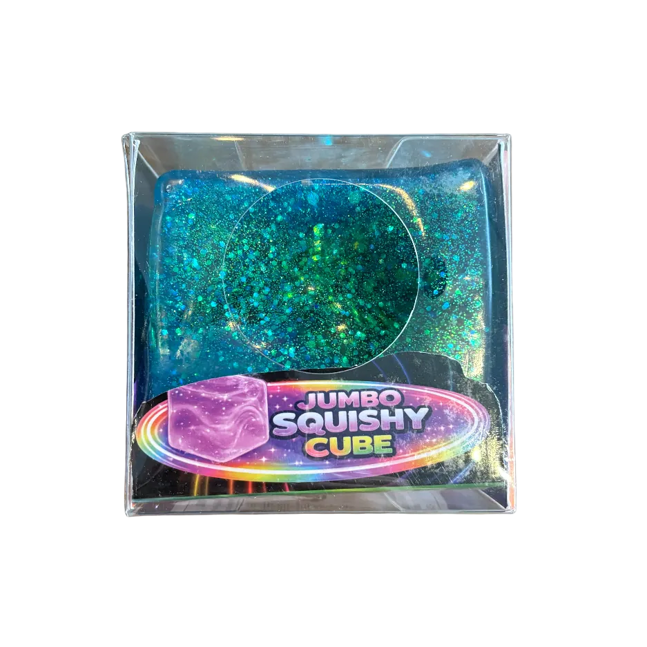Jumbo squishy cube in packaging on a wooden surface