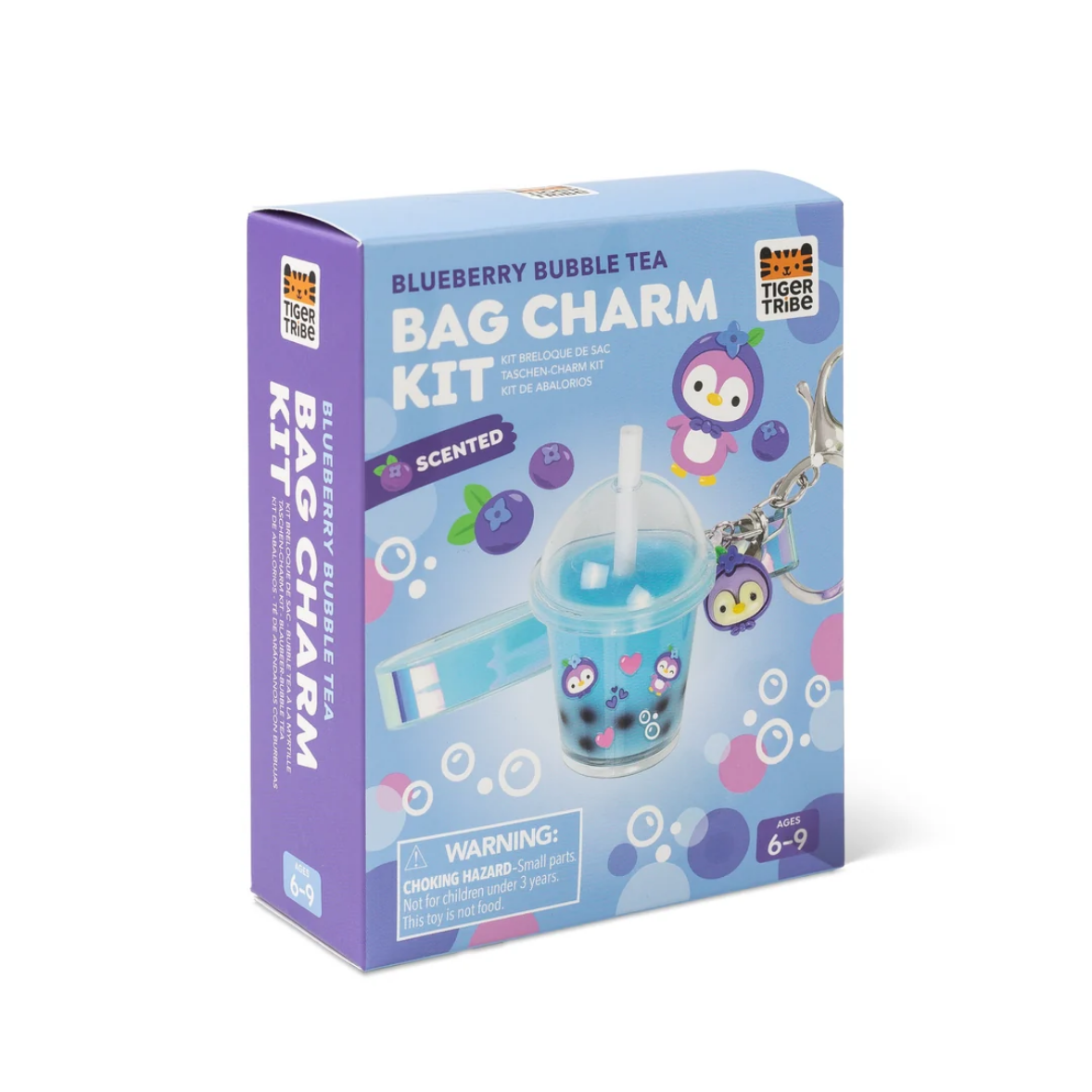 Tiger Tribe Blueberry Bubble Tea Bag Charm Kit in its retail packaging, featuring a purple box with illustrations of a blueberry iced tea bag charm and cartoon penguin characters.