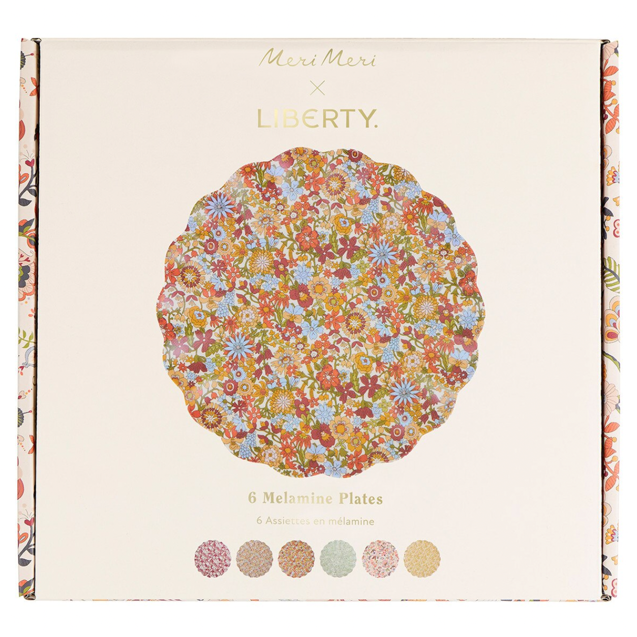 Meri Meri x Liberty 6-piece melamine plates set in its original packaging, featuring a central round plate with a colorful floral pattern and six color swatches at the bottom.