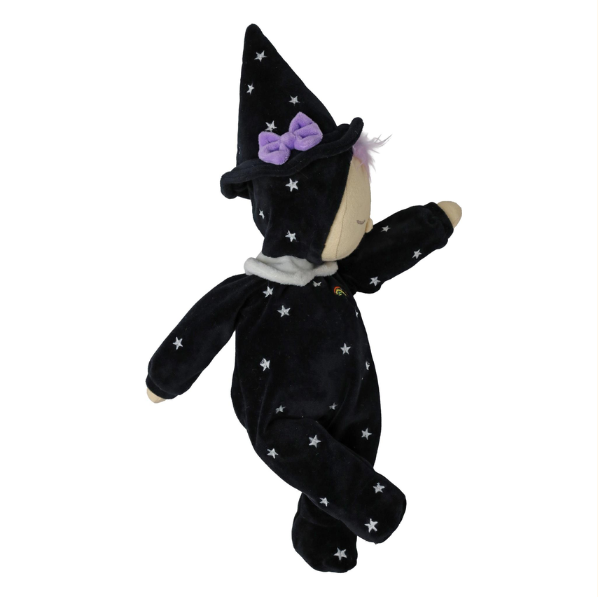 A plush witch doll wearing a black velvet costume with white star patterns, a pointed hat with a purple bow, and a light beige face, shown against a plain white background.