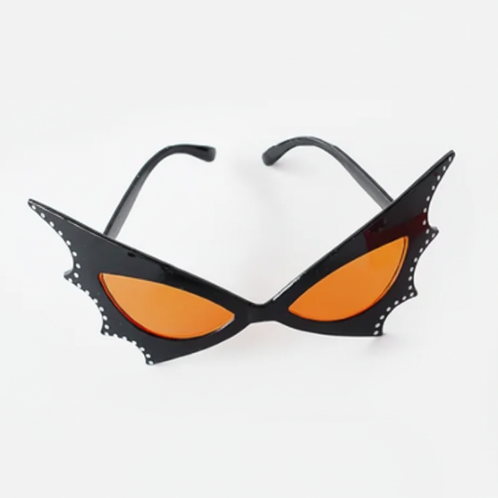 Three pairs of Halloween-themed cat-eye sunglasses on a clean white background: a black bat-wing frame with orange lenses, a black spiderweb frame with dark lenses, and an orange pumpkin frame with a carved face.