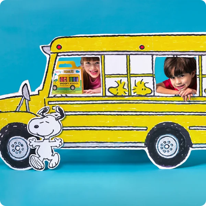 Yellow school bus with children peeking out and Snoopy on a blue background