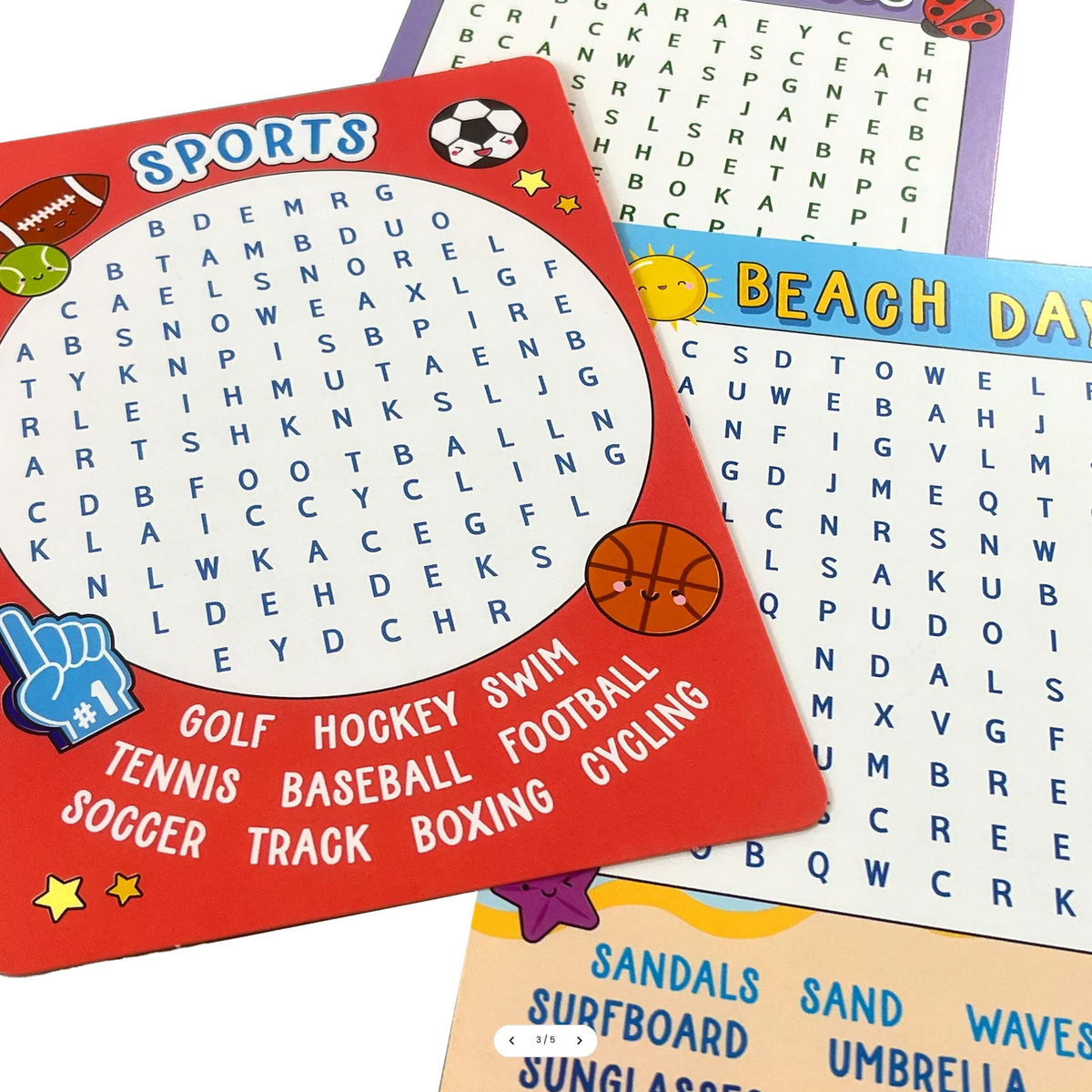 Three colorful children's word-search activity cards laid on a white background. The top card is red and sports-themed with words like golf, hockey, swim, tennis, baseball, football, soccer, track, boxing, and cycling.