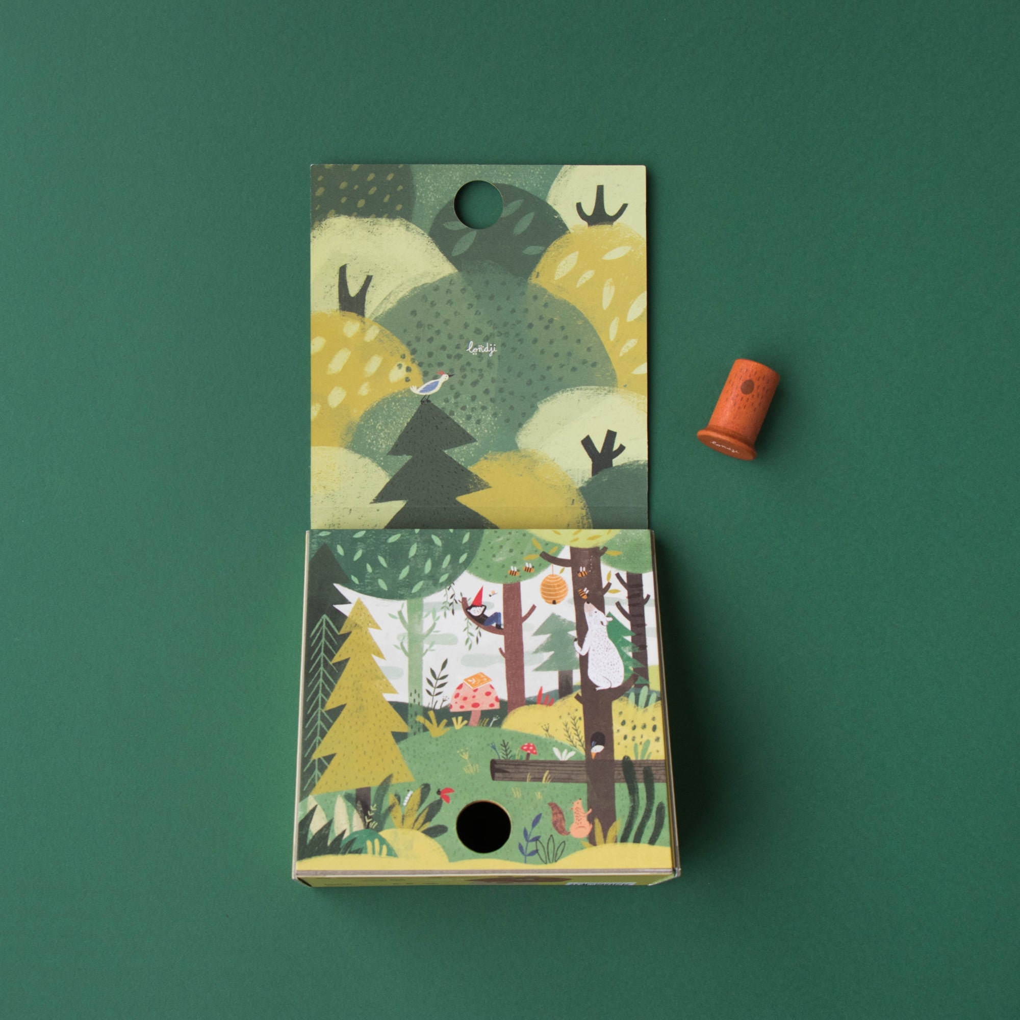 Packaging with nature-themed design on a green background