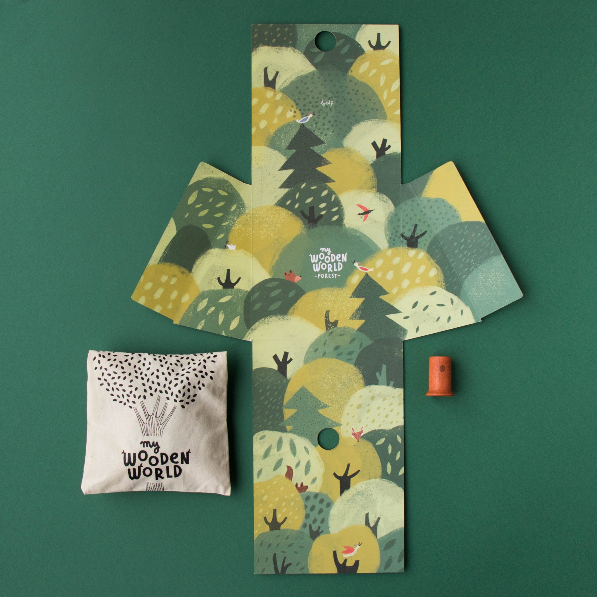 Three decorative items with nature-themed designs on a green background