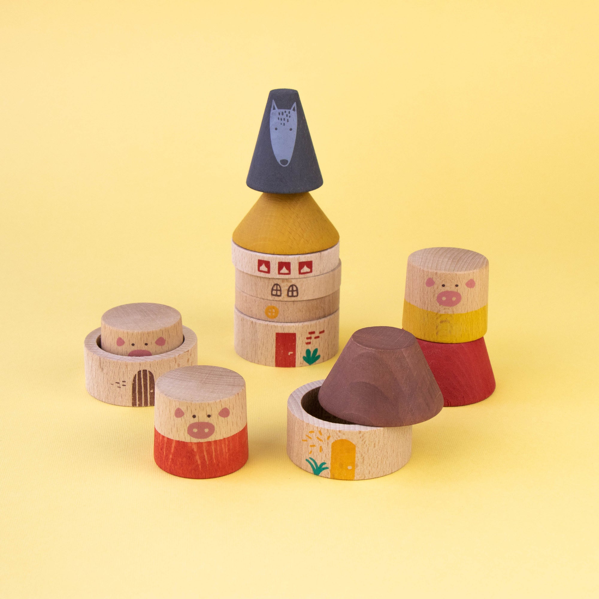 Set of colorful wooden toys on a yellow background