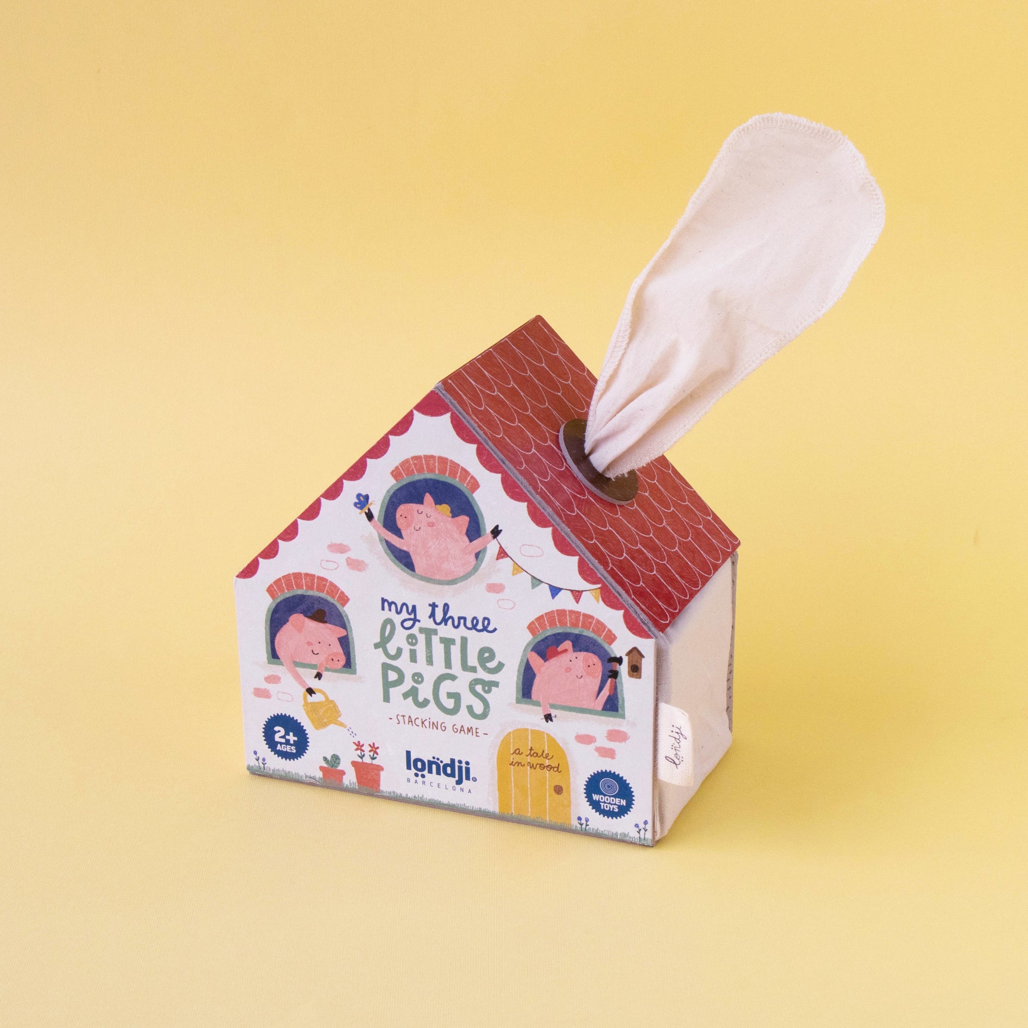 House-shaped tissue box with cartoon characters on a yellow background