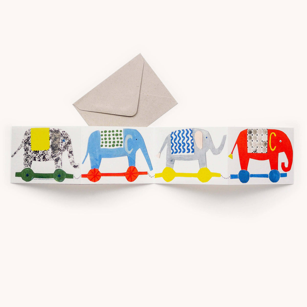 Colorful card with four patterned elephants on a white background