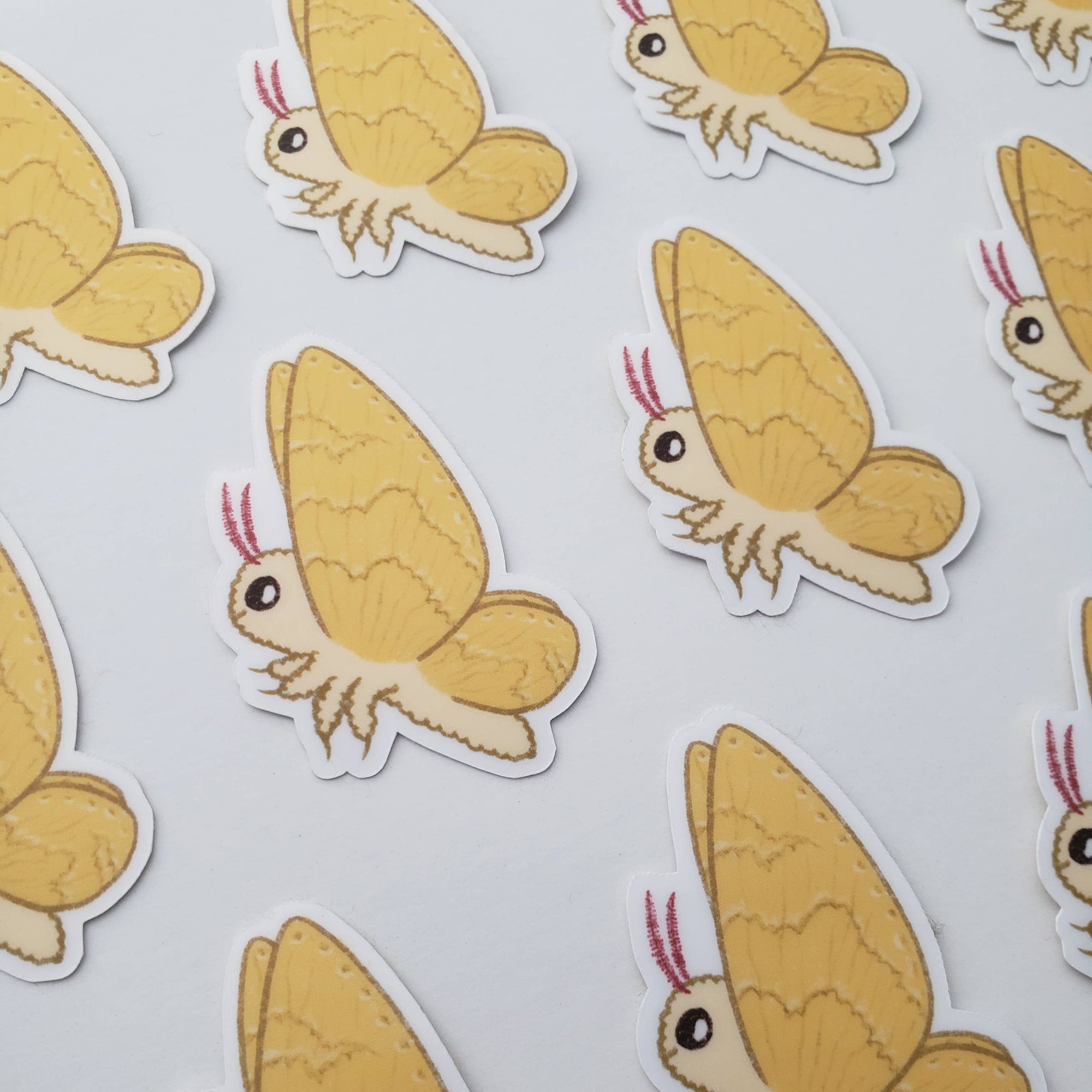 Repeating pattern of cartoonish brown bugs on a light gray background
