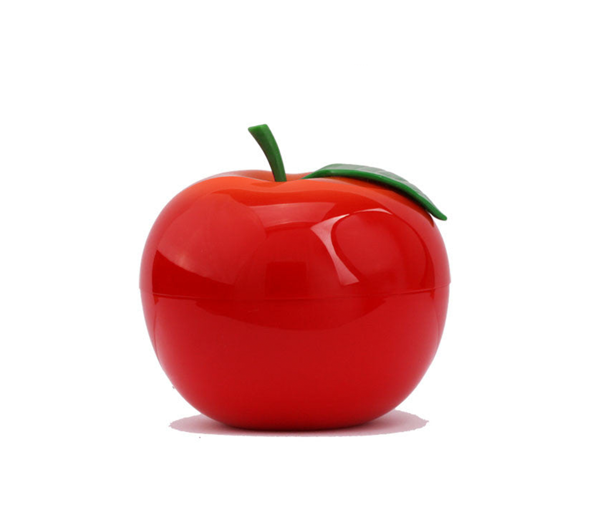 Glossy red apple with a green leaf on a white background