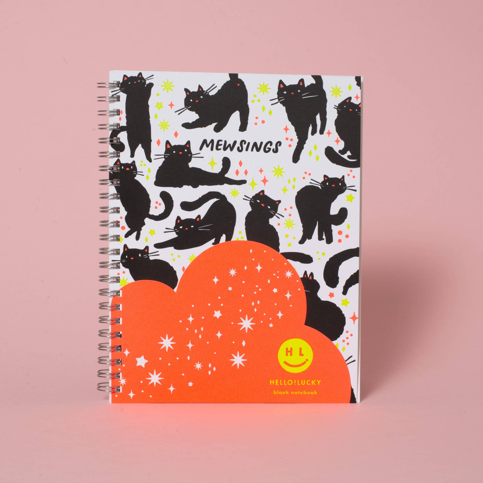 Notebook with cat pattern on a pink background