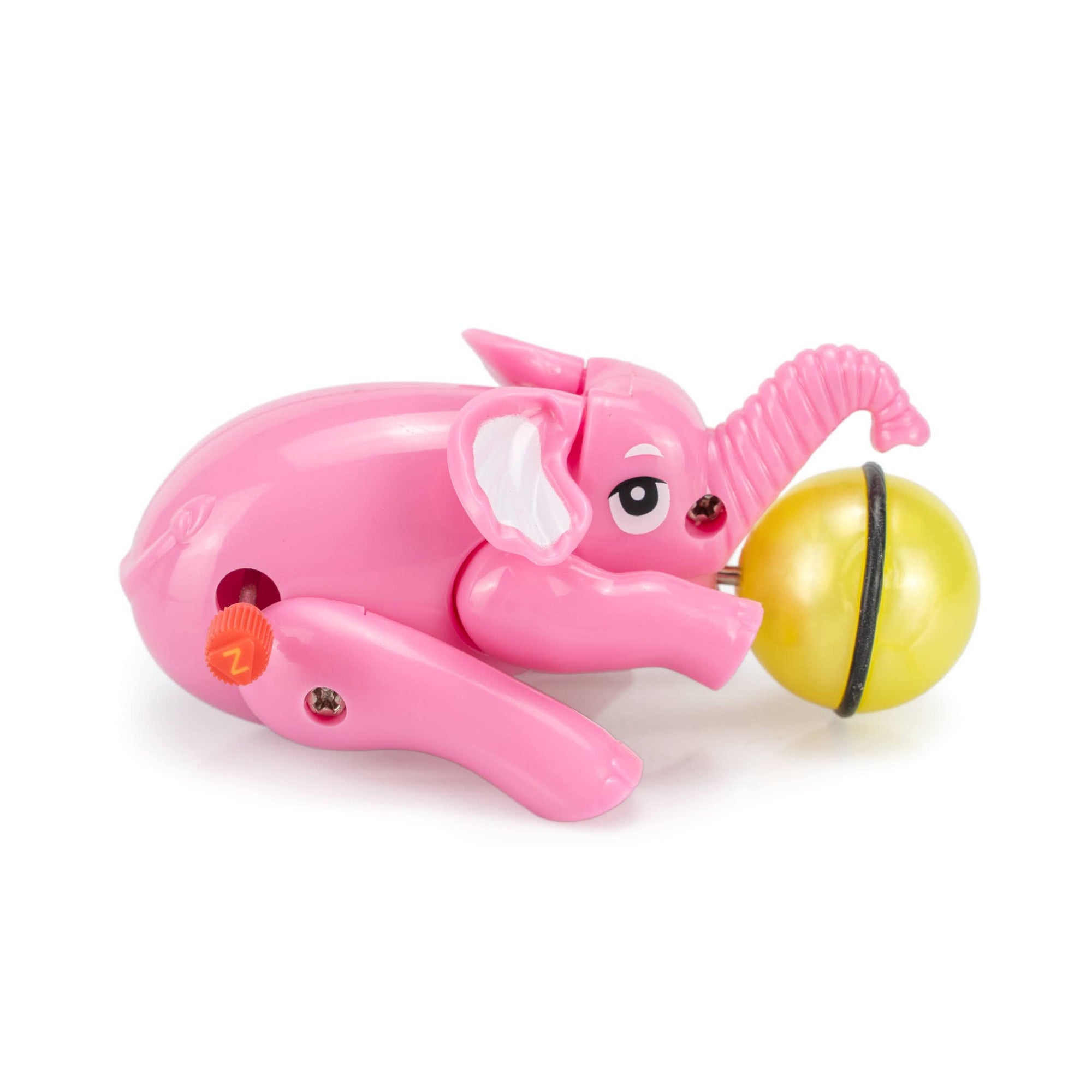 Pink elephant toy with a yellow ball on a white background
