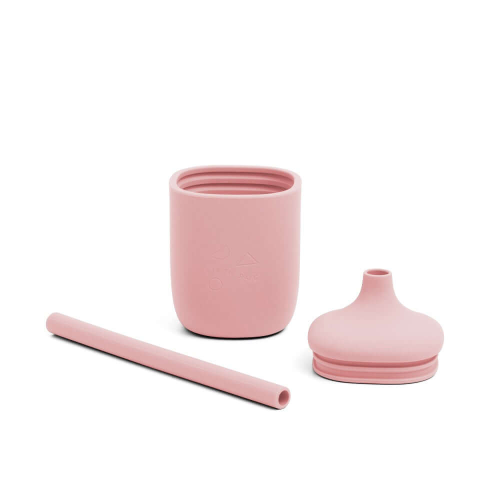 Set of pink sippie cup including a cup, straw, and lid on a white background