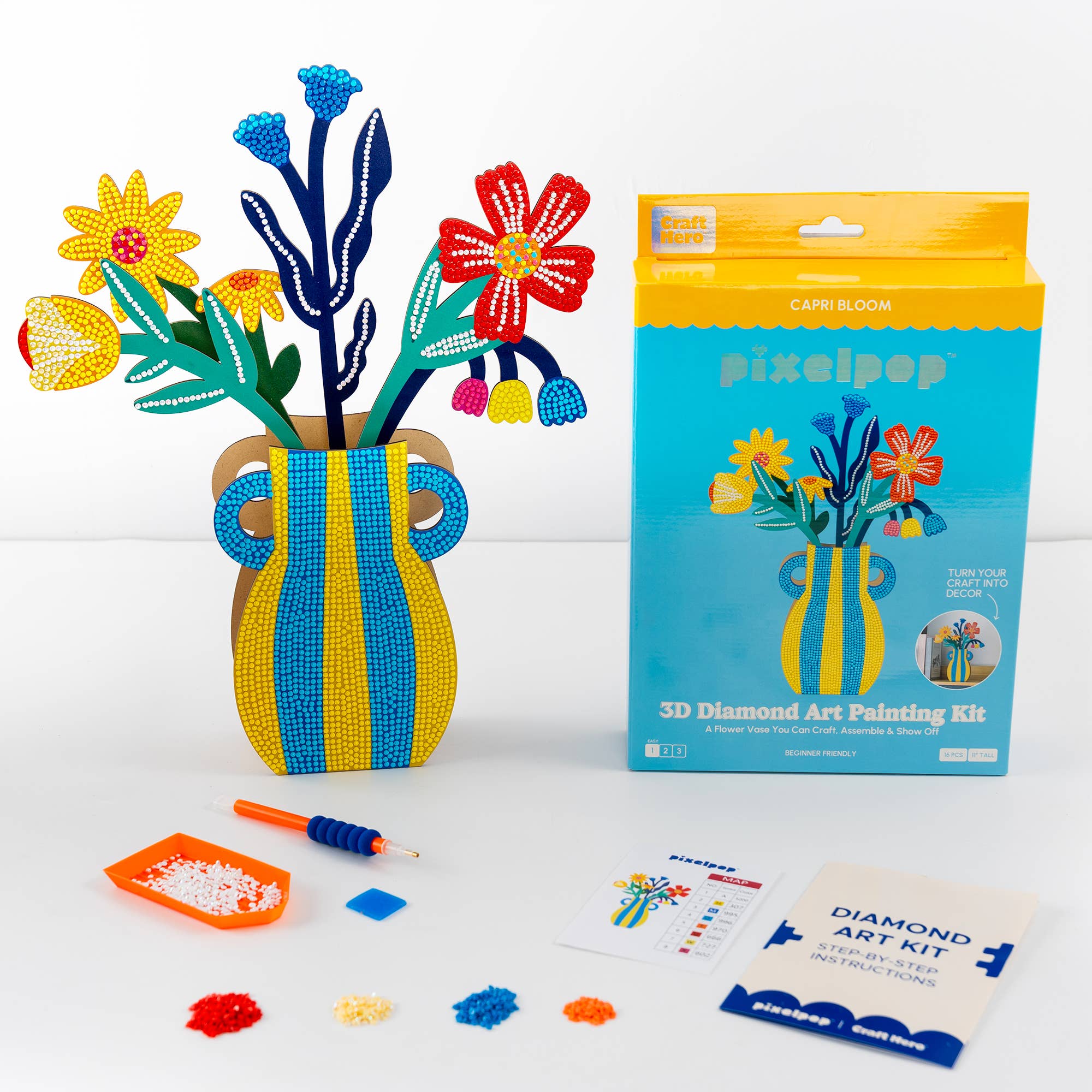 3D diamond art painting kit with completed vase and flowers, packaging, and tools on a white background.