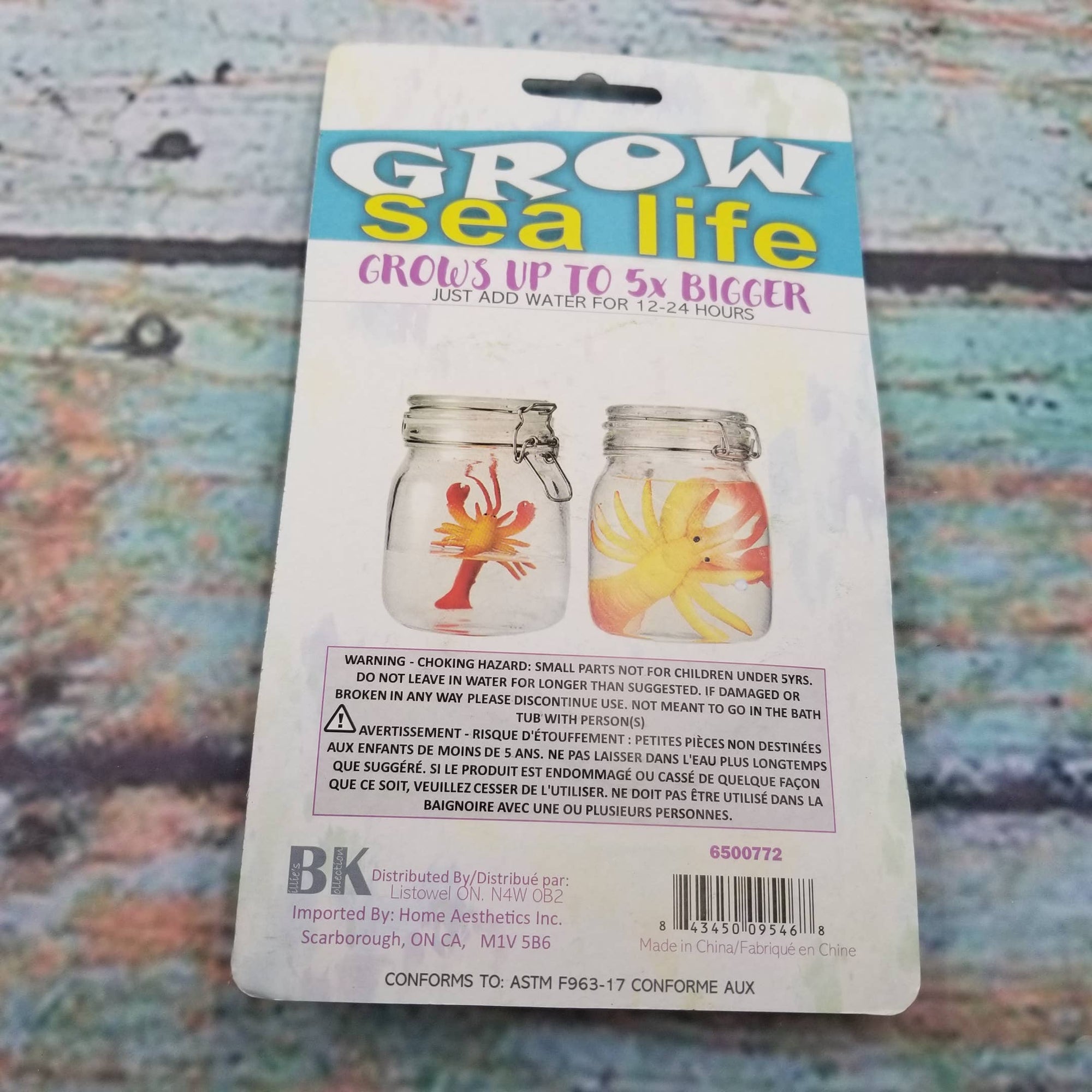 Packaging for 'Grow sea life' product with two small jars on a textured background