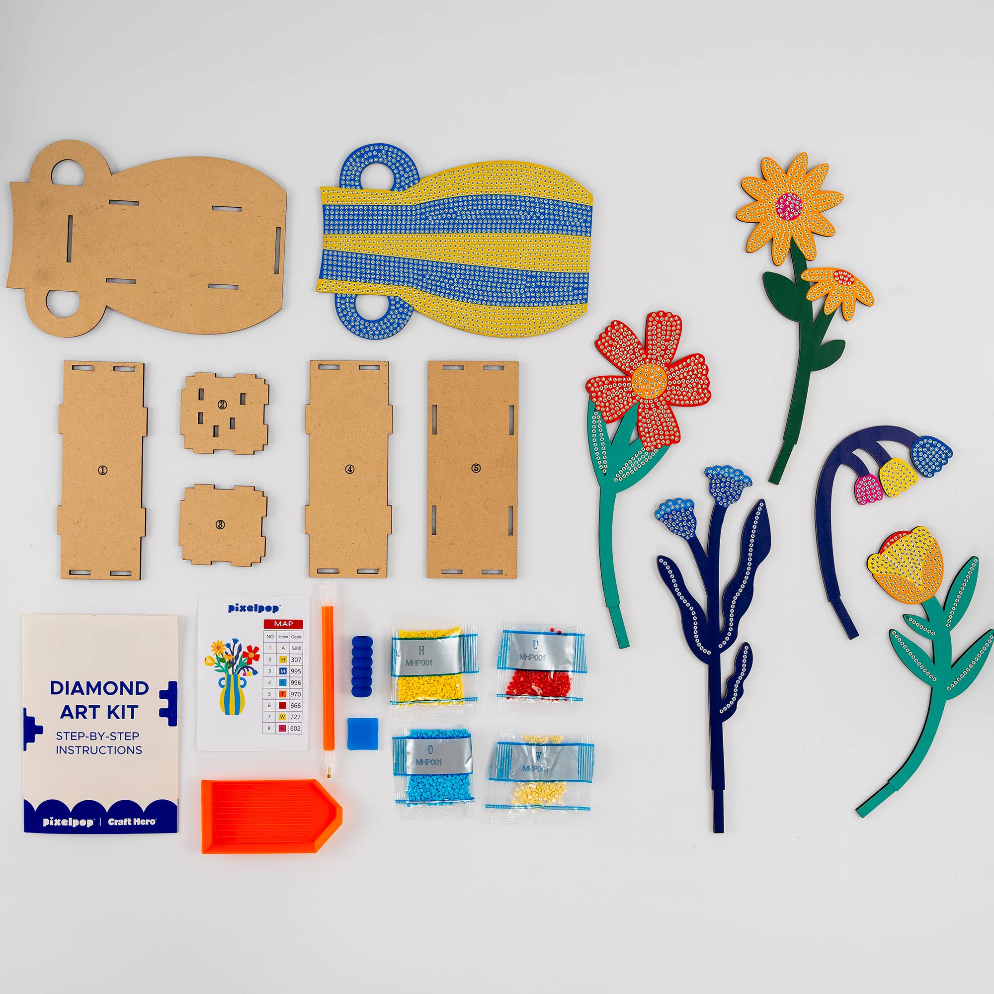 Diamond art kit with cardboard pieces and colored diamonds on a white background