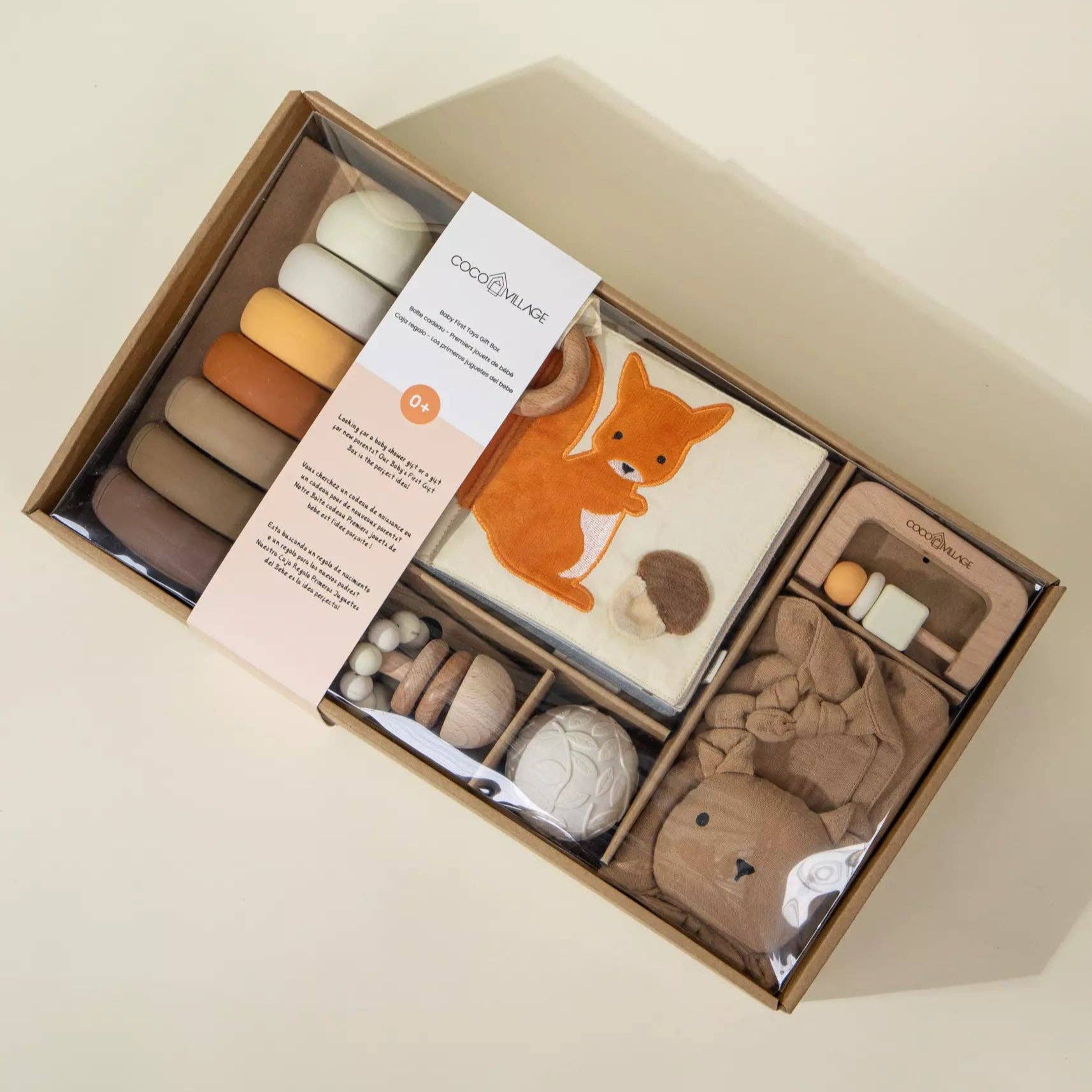 Baby product set with fox design in a box on a beige background