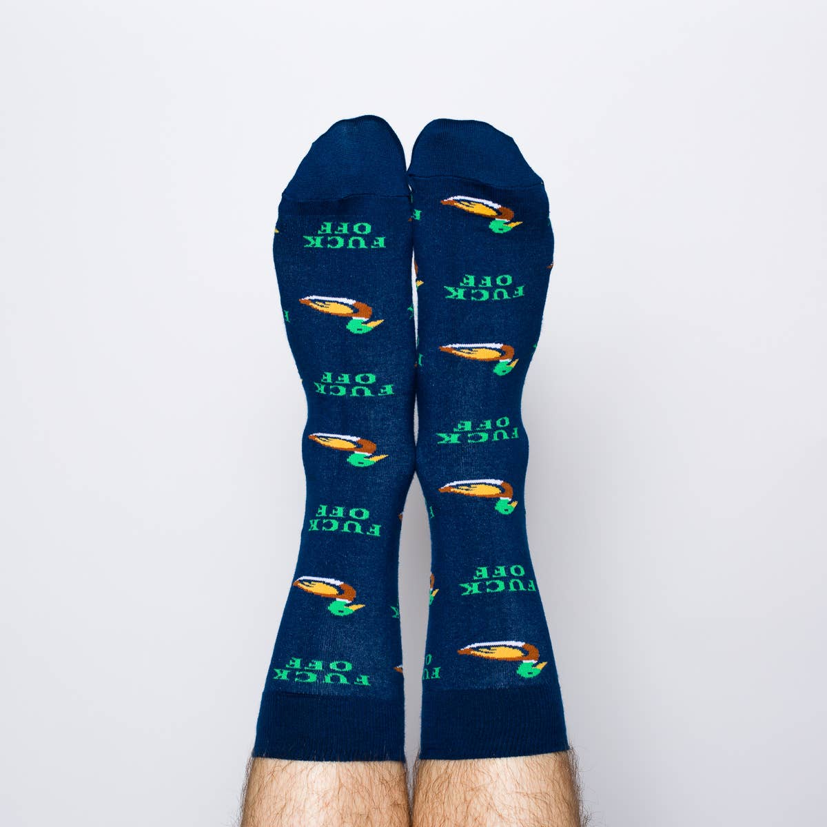 Pair of blue socks with graphic designs and text on a white background