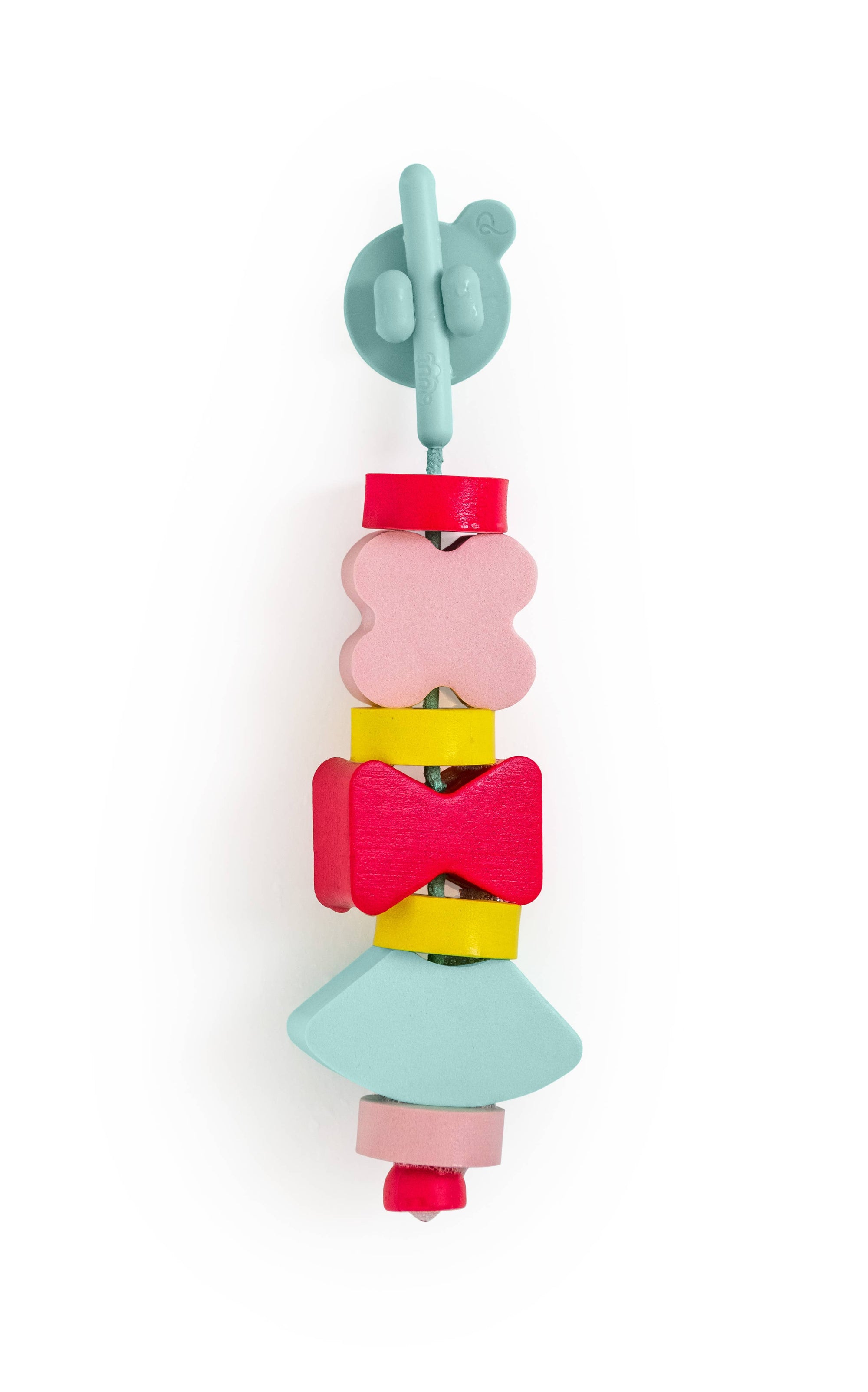 Colorful foam baby lacing toy with geometric shapes on a white background