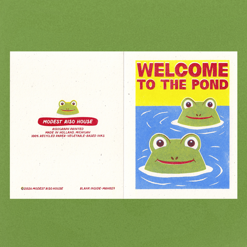 A square art print or card shown flat against a green background, featuring a split design: the left panel is mostly white with a small frog illustration and text reading 'MODEST RISO HOUSE,' and the right panel shows two cartoon frogs in blue water with a yellow header reading 'WELCOME TO THE POND.'.
