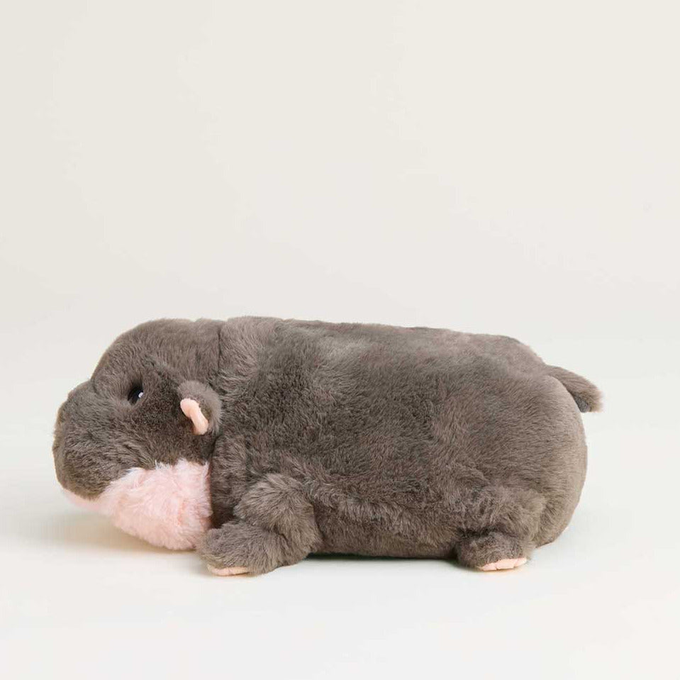 Plush toy resembling a gray rodent on a light gray background