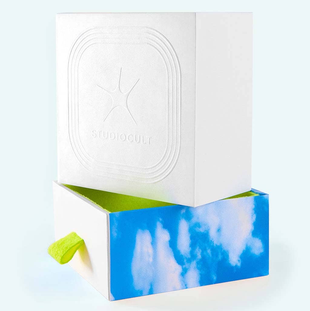 White box with a blue and green design on a light gray background