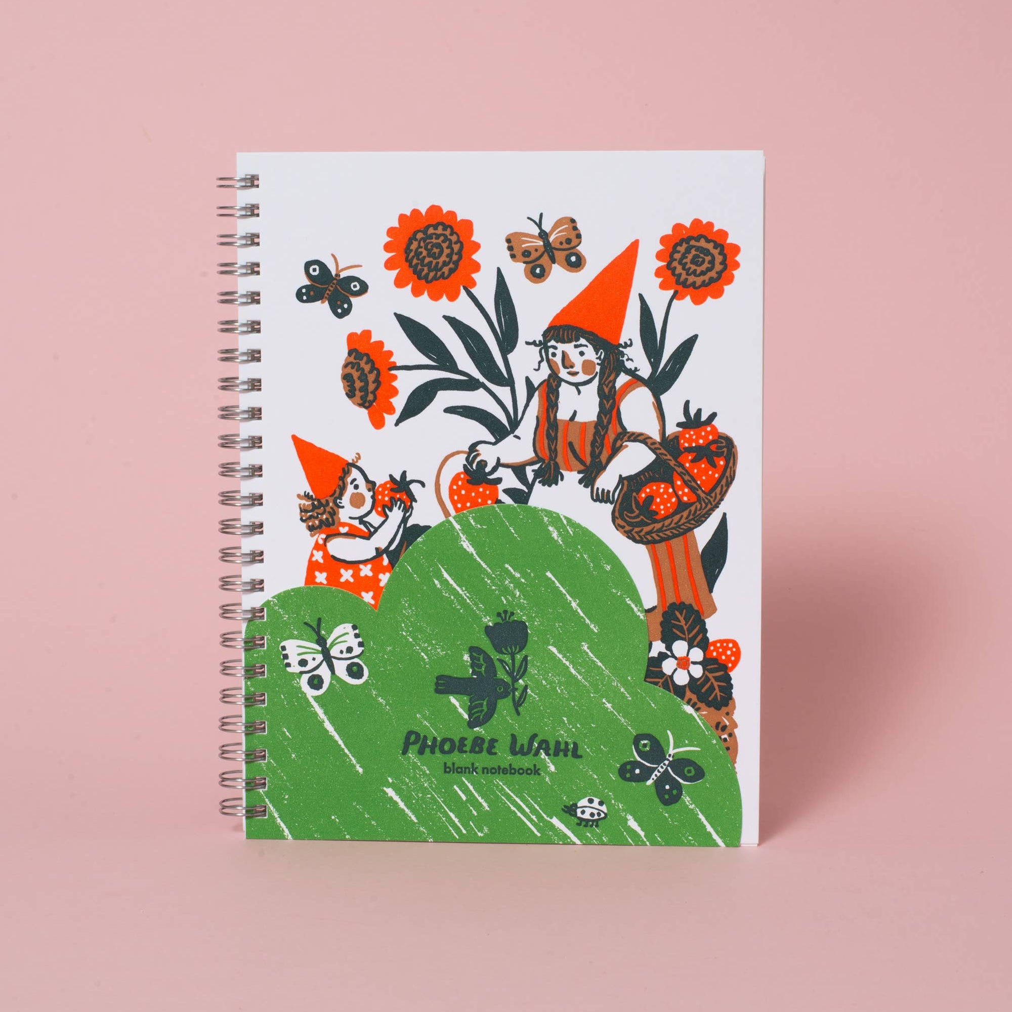Notebook with a colorful design on a pink background