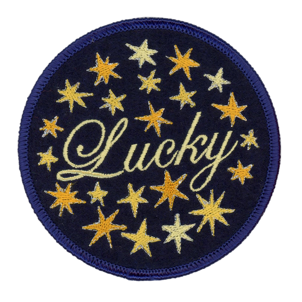 Circular patch with 'Lucky' text and yellow stars on a blue background